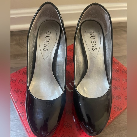 Used black guess high heels with normal tear from use. - Picture 2 of 5